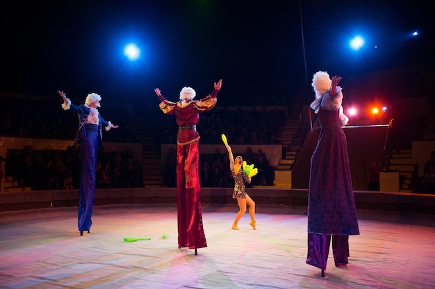 jugglers in the circus clown on stilts
