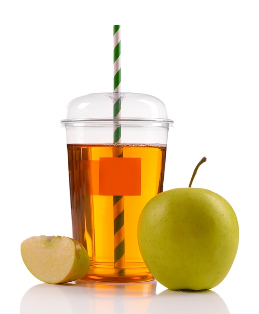 Photo juice in fast food closed cup with tube and apples isolated on white