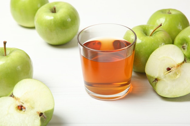 Juice from green apples on the table