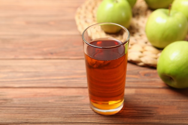 Juice from green apples on the table