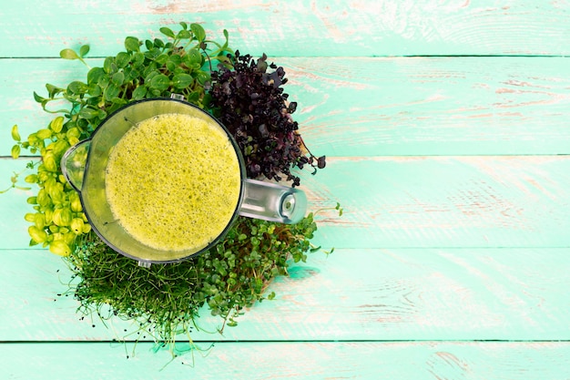 Juice from microgreens in a blender top view