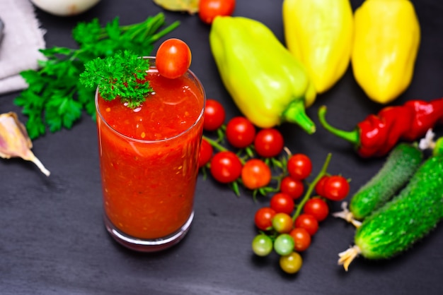 Juice from a red tomato in a glass 