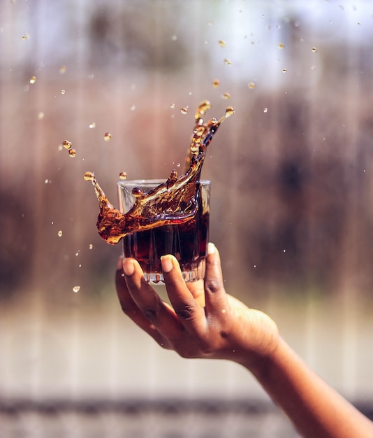 Juice glass on blurred garden background