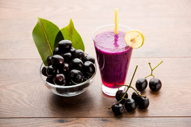 Juice of jamun fruit in a glass also called as java plum, jambolan plum, jambhul, syzygium cumini