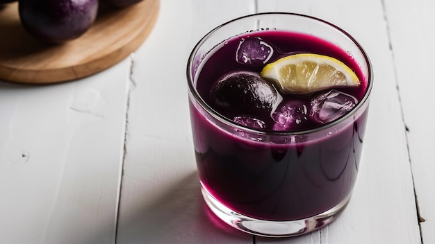 Photo juice of jamun fruit in a glass also called as java plum jambolan plum jambhul syzygium cumini