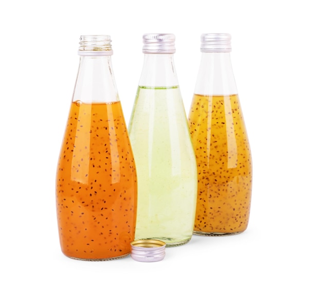 Juice with chia seeds in a bottle on a white background