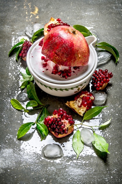 Juicer with bits of pomegranates and leaves