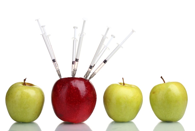 juicy apples and syringes isolated on white