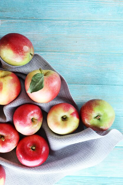 Juicy apples on wooden table closeup