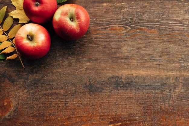 Juicy autumn harvest and leaves on the wood surface. fall.