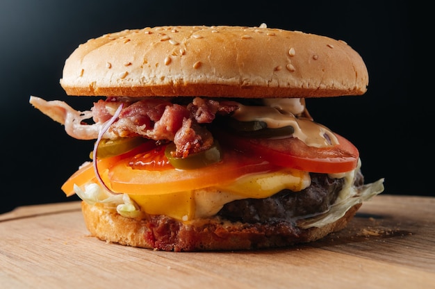 Juicy burger with bacon Typical restaurant burger for bars grill bars menu fanpage