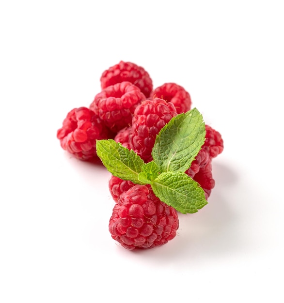 Juicy forest raspberry with mint leaf on a white isolated background