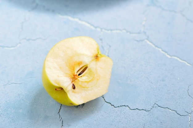 Juicy fresh yellow apples with water drops in a plateknife for cutting apples