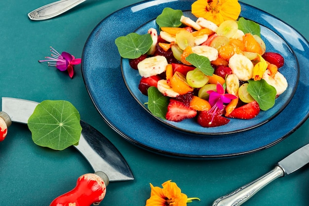 Juicy fruit salad with nasturtium