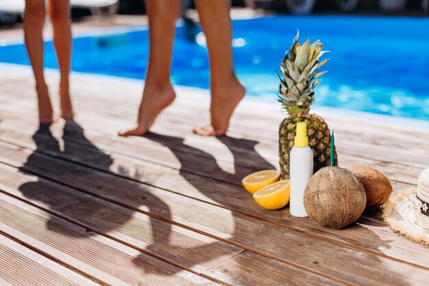 Juicy fruits on the ground near the pool