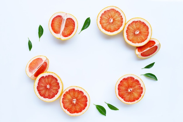 Juicy grapefruits on white surface