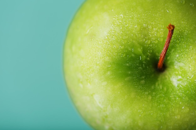 Juicy Green apple on a green background with a minimalistic composition.