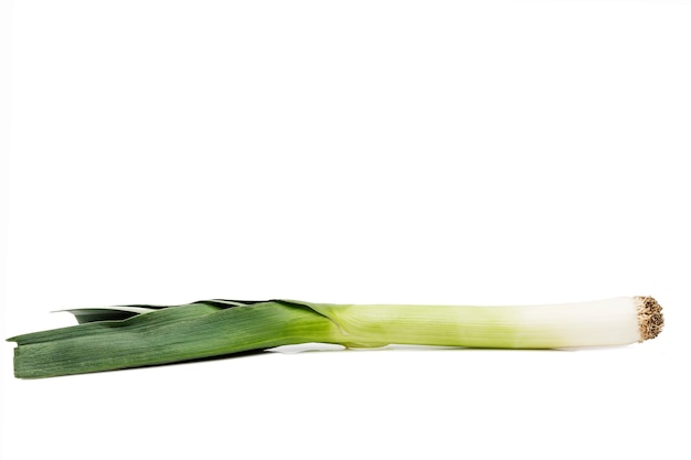 Juicy leeks on an isolated white surface. Healthy food and vitamins. Space for text.