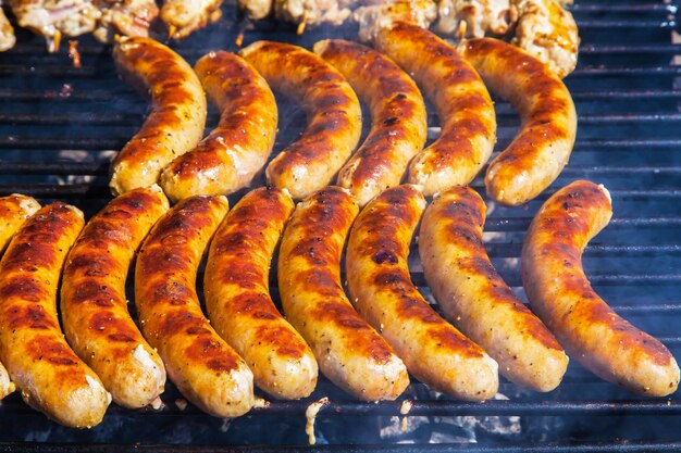 Juicy mouthwatering grilled sausages closeup