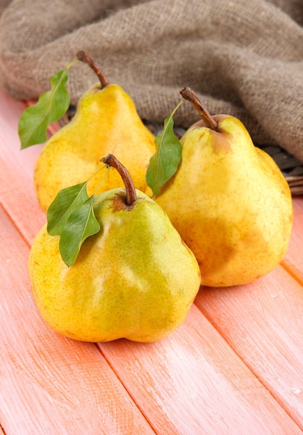 Photo juicy pears on table closeup