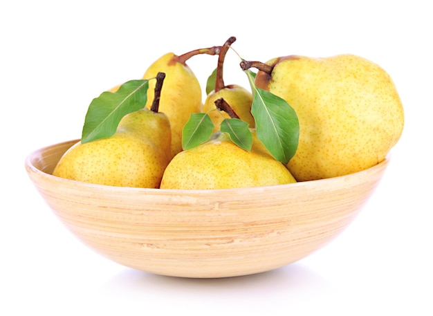 Juicy pears in wooden bowl isolated on white