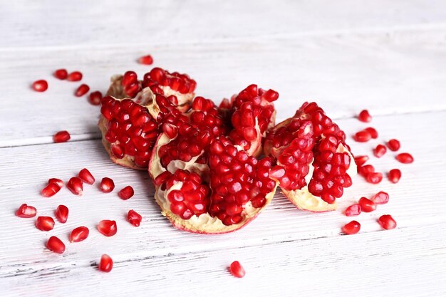 Juicy pomegranate on old wooden table