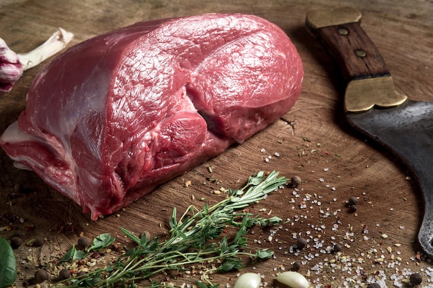 Juicy raw beef steak on wooden table