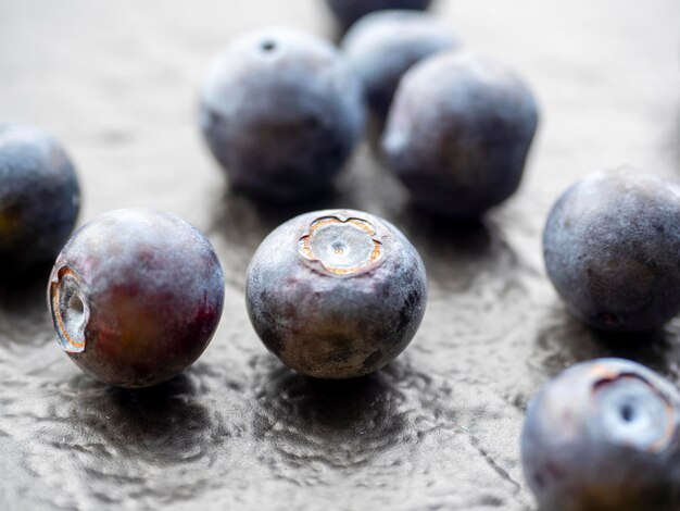 Juicy ripe blueberries on a textured dark background. Close-up, berries, edaa