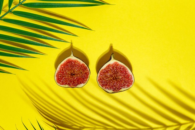 Juicy ripe fruit figs on a yellow background Diet food Bright summer concept