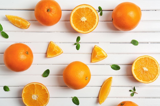 Juicy ripe oranges on light background