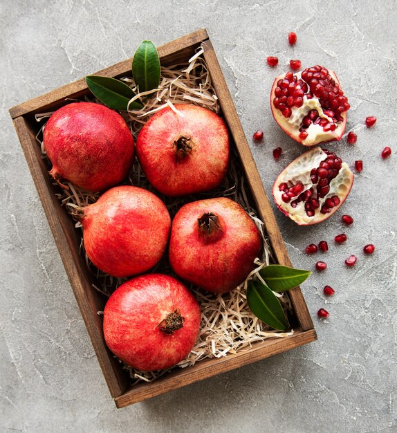 Juicy and ripe pomegranates in the box