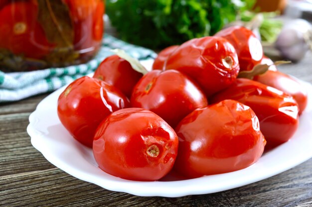 Juicy spicy marinated tomatoes with pepper and garlic