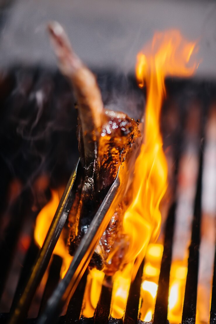 Juicy steak is grilled in a restaurant