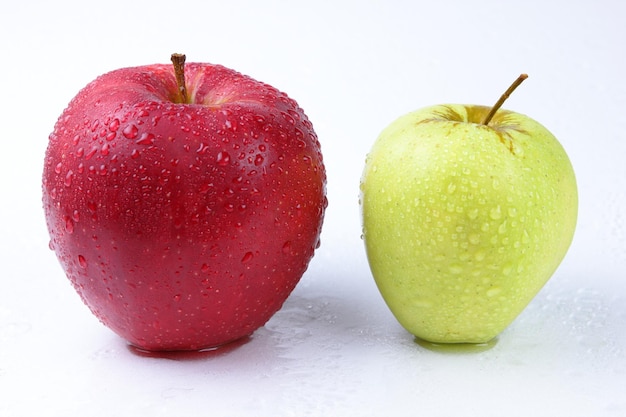 Juicy sweet whole green and red apples isolated on white background Healthy food concept Closeup of a green fruit