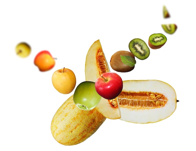 Juicy tasty fresh melon kiwi grape apple levitate on a white background healthy diet Fresh fruits and vegetables