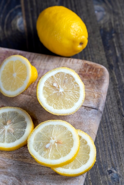 Juicy yellow lemon on a chopping board during cooking