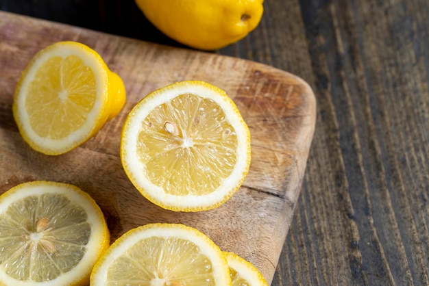 Juicy yellow lemon on a chopping board during cooking