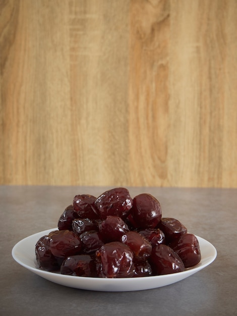Jujube in syrup on a white plate