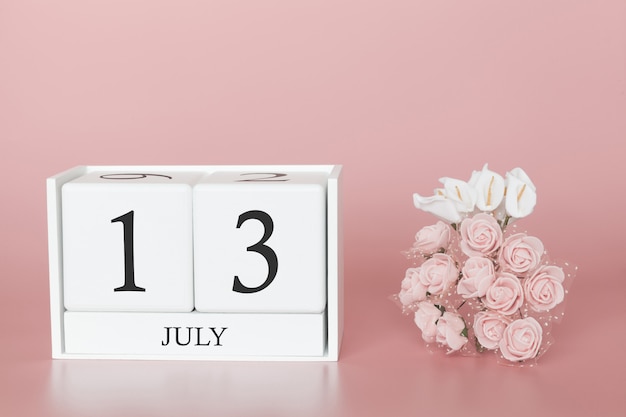 Premium Photo | July 13th. Day 13 of month. Calendar cube on modern pink