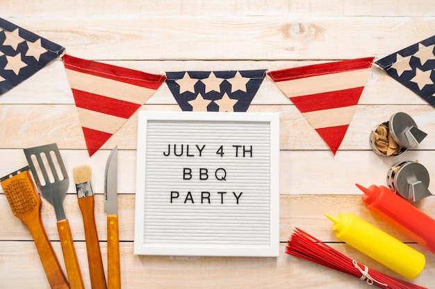 July 4th BBQ Party sign on a white mamo board.