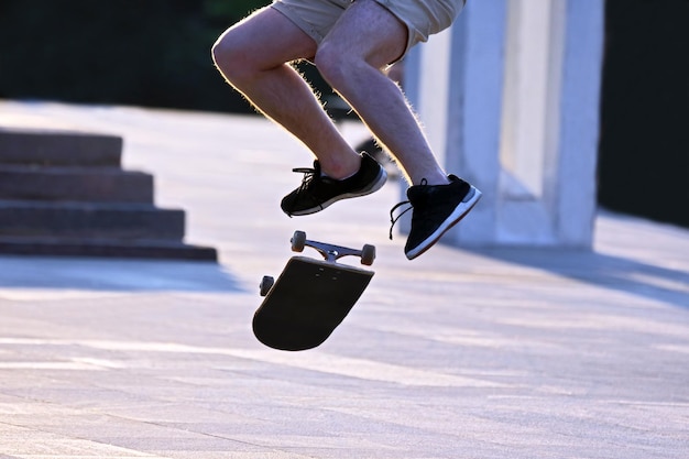 Jump to bowl a guy on a skateboard