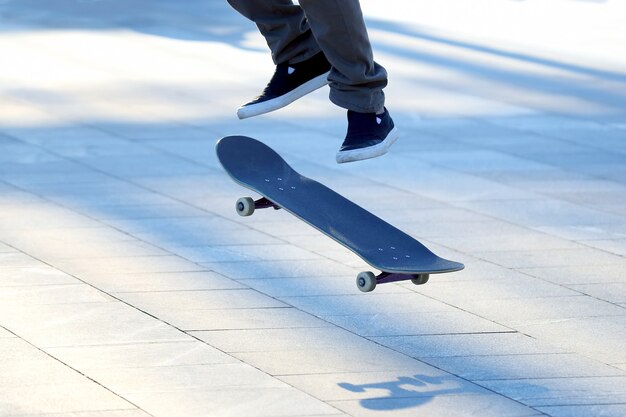 Jump a young man on a skateboard