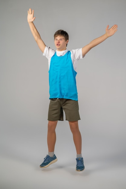 Jumping. A boy in sportswear jumping and looking enjoyed