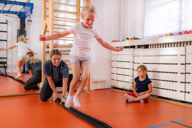 Photo jumping over rope in a physical activity class