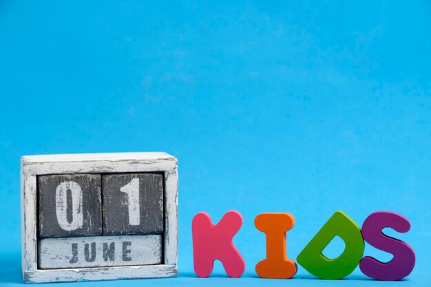 June 1 calendar Child protection Day word kids is laid out blue bright background