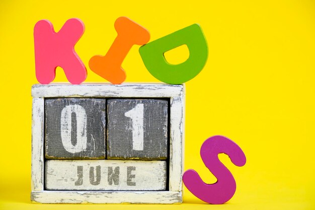 June 1 calendar child protection day word kids is laid out yellow bright background