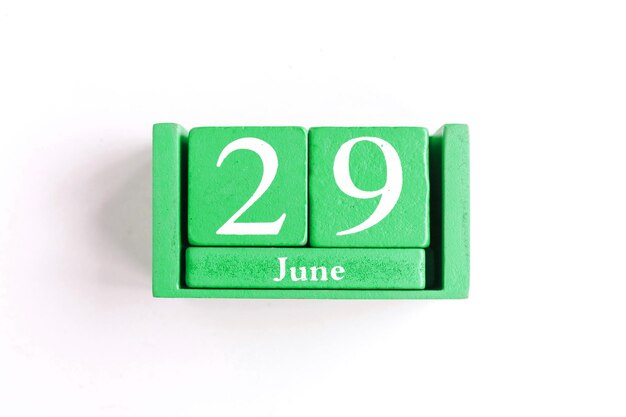 Photo june 29 blue cube calendar with month date isolated on white background