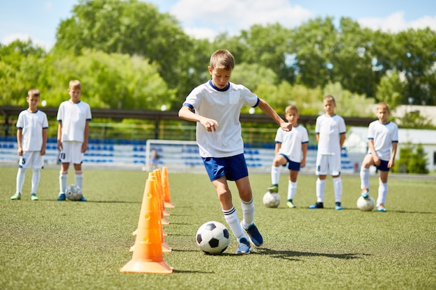 Junior football player presso practice