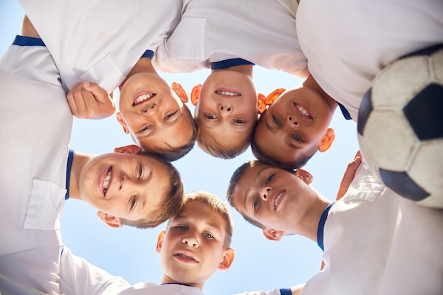 Junior Football Team Huddling Before Match