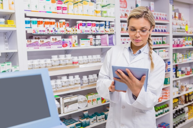 Junior pharmacist using tablet pc